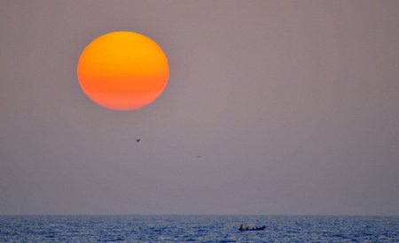coucher de soleil mer saison des pluies au Sénégal