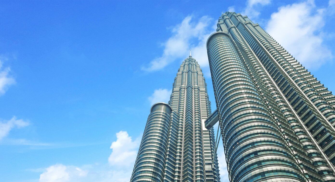 MALAYSIA, KUALA LUMPUR 16 October 2018. The Petronas Twin Towers on sky background. Tallest buildings in the world until 2004