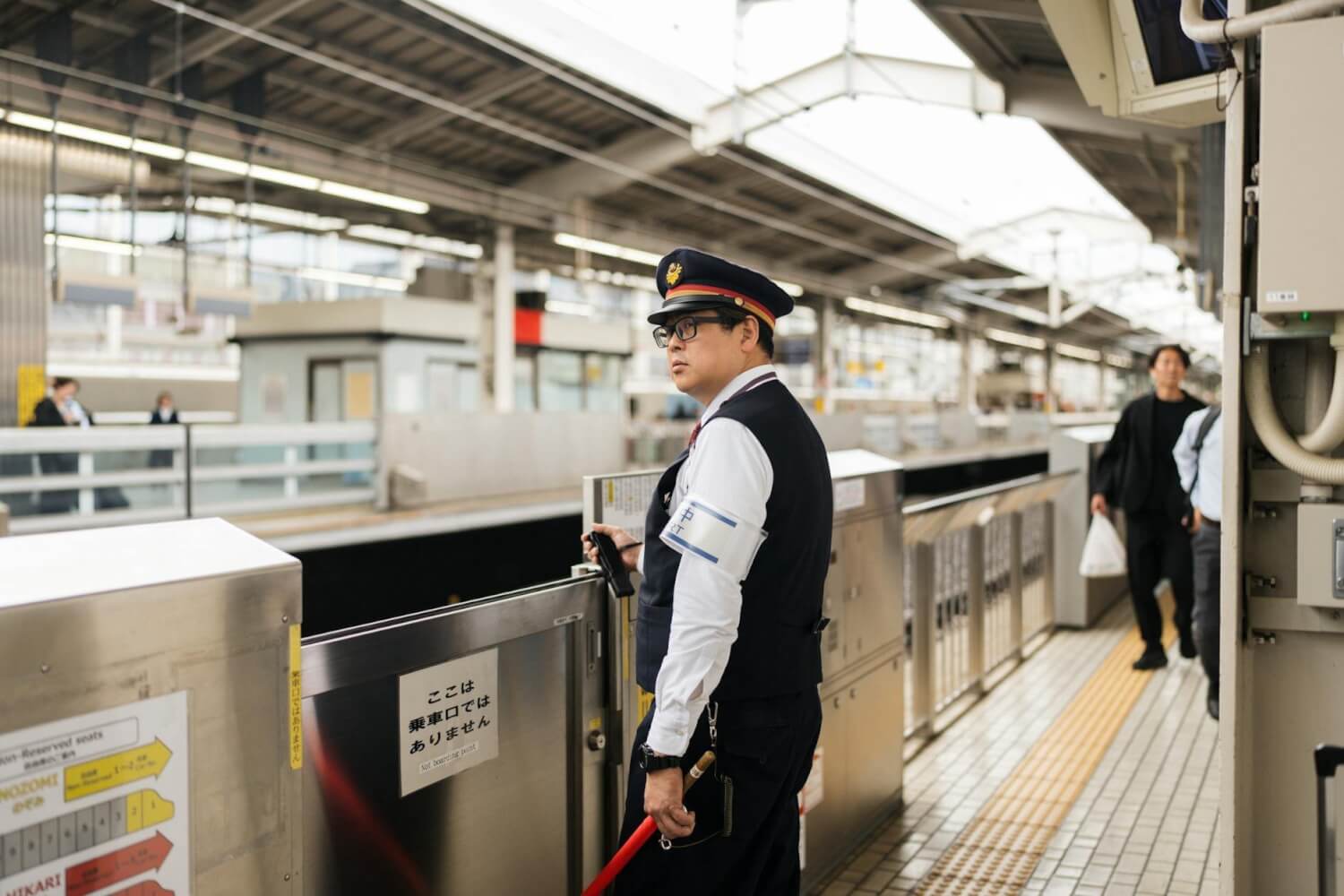 japanese train station with security guard