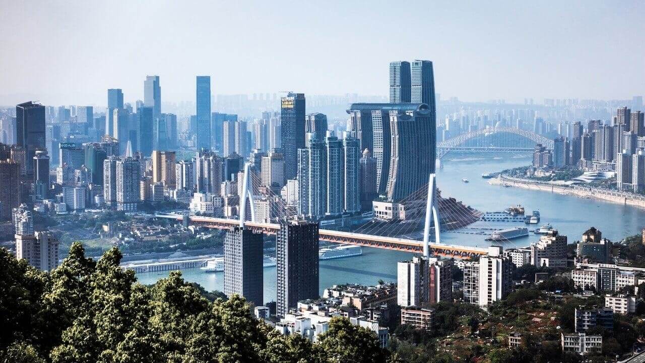 city skyline near body of water during daytime